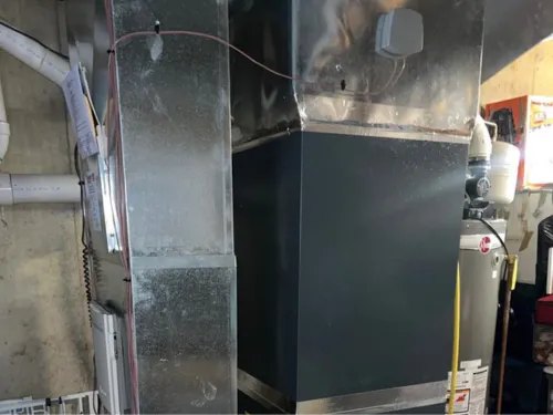 Sheet-metal plenum and duct transition in a basement