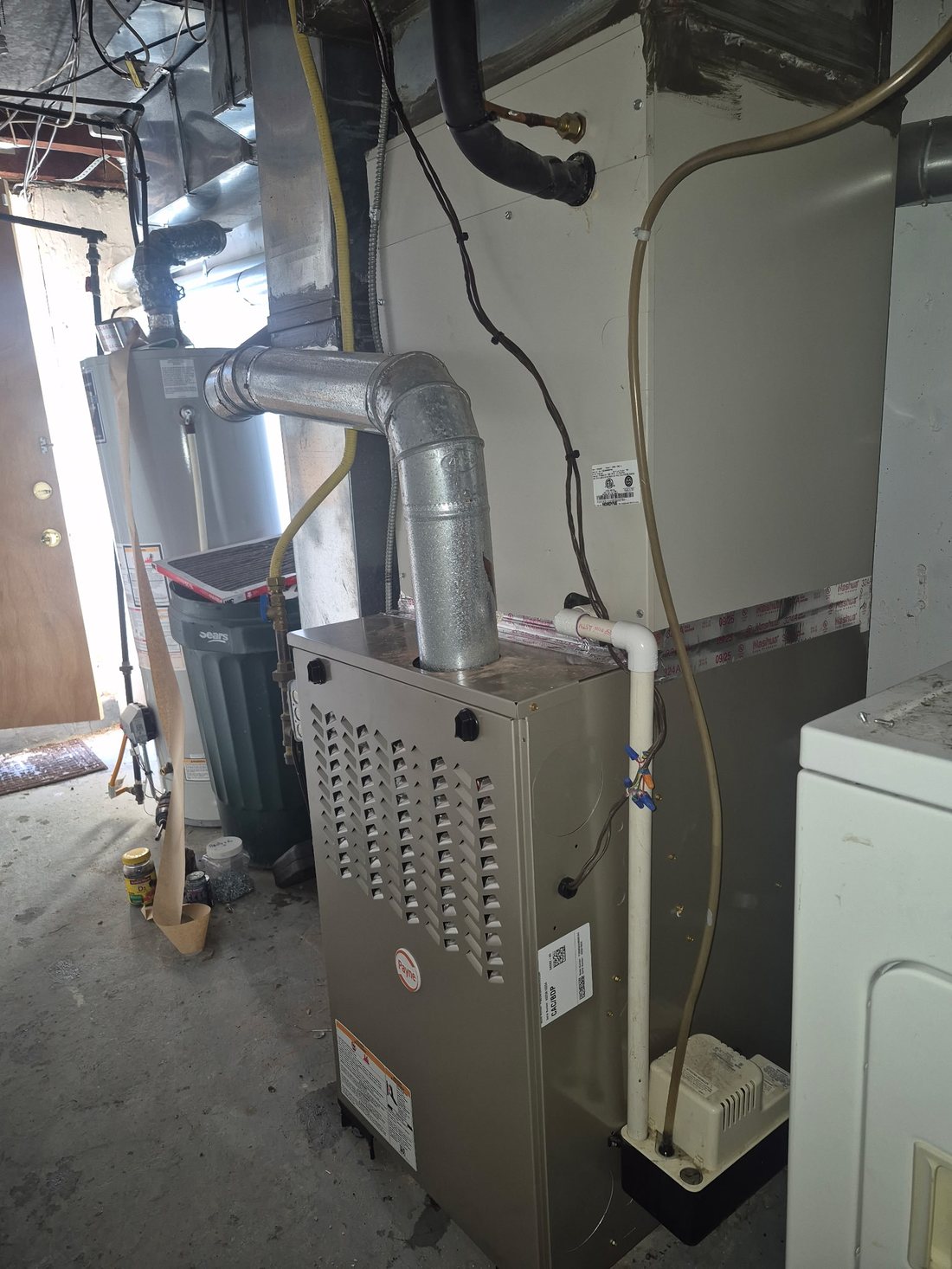 Payne gas furnace with new flue pipe and condensate pump in a Hatboro-area basement